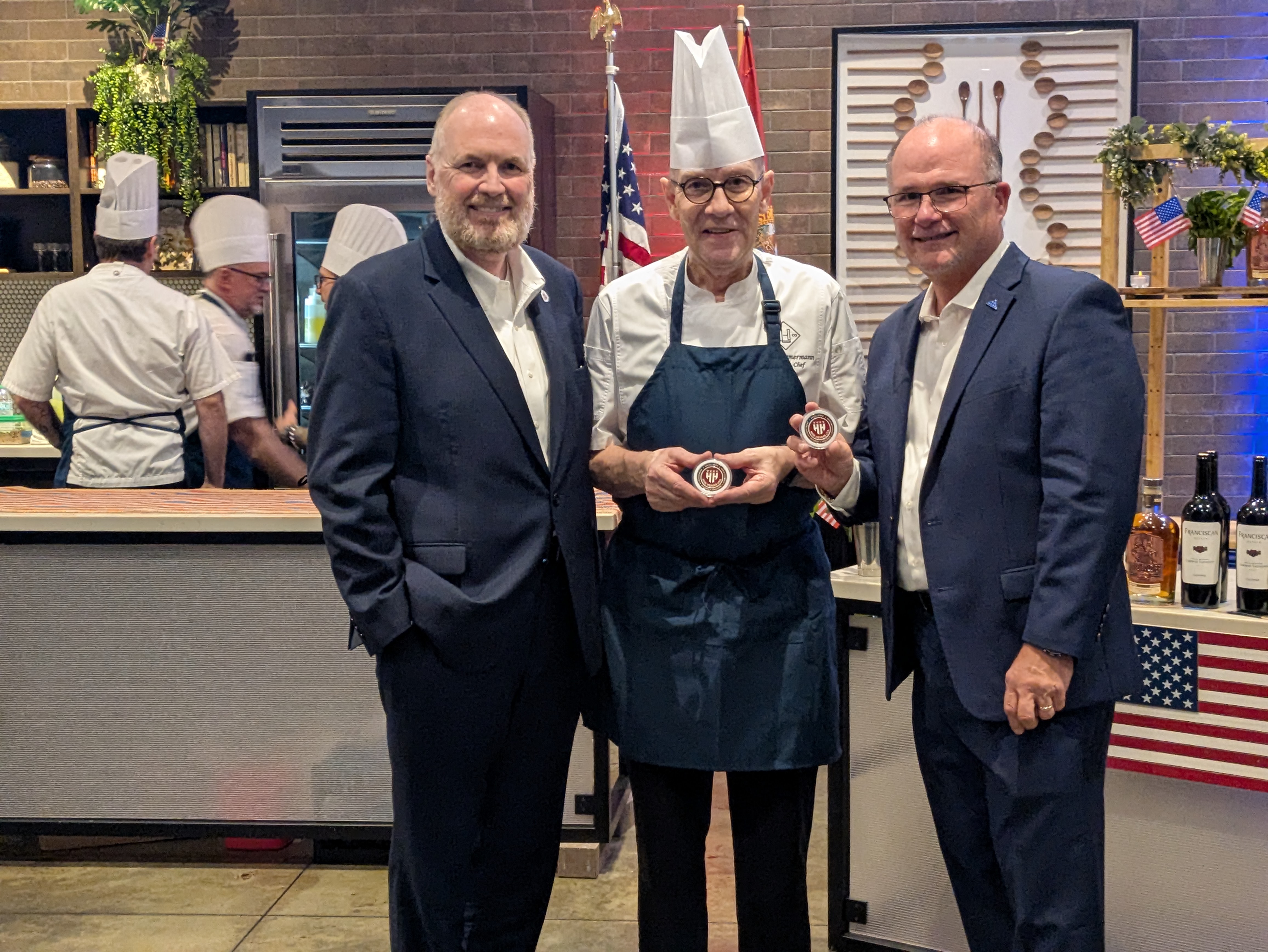 James Gillen, CFRE presenting challenge coins to Chef Josef and General Manager Joseph Shurmer of the Luminary Hotel. James Gillen, CFRE presenting challenge coins to Chef Josef and General Manager Joseph Shurmer of the Luminary Hotel.